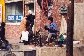 A cycle and shoe repair "shop" in Beijing