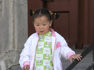 Little girl walking down the steps of the palace