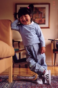 Yanmei with new Adidas shoes - the left shoe was bought by Thomas, May 2001