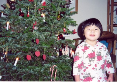 Yanmei infront of the Christmas tree - December 2000